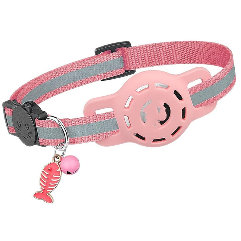 Pink cat collar with a bell and fish charm on a white background